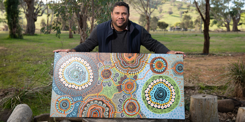luke Luke Penrith showcasing his artwork in a bushland clearing